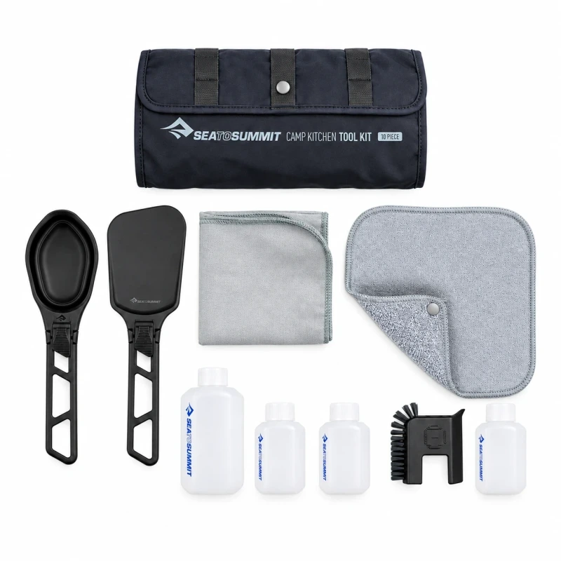 Sea to Summit Camp Kitchen Tool Kit with its black case, folding utensils, cloths, four bottles and brush on white.