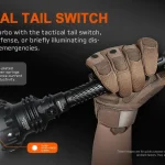 ACEBEAM P20 tactical tail switch shown in a gloved hand.