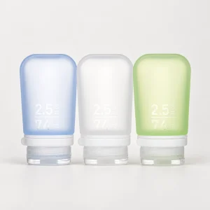 humangear GoToob+ three-pack 2.5 fl oz / 74 mL, pale blue left, clear frosted white center, pale lime green right