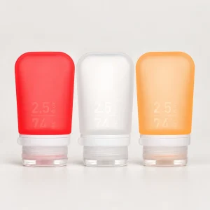 humangear GoToob+ three-pack 2.5 fl oz / 74 mL, red left, frosted clear white center, orange right
