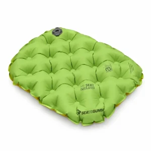 Sea to Summit Air Seat Insulated, exactly one inflated almost-square lime-green sitting cushion with four-by-four checker dimples/air-sprung cells, scalloped welded perimeter, thin mustard bottom edge, one dark-gray round valve at back edge.