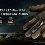 ACEBEAM TAC 2AA held in a gloved hand with an outdoor night scene.